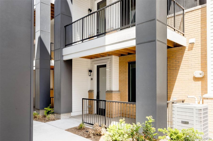 Front exterior of a new home in A Line Townhomes, Denver, CO, highlighting curb appeal (Image 2).