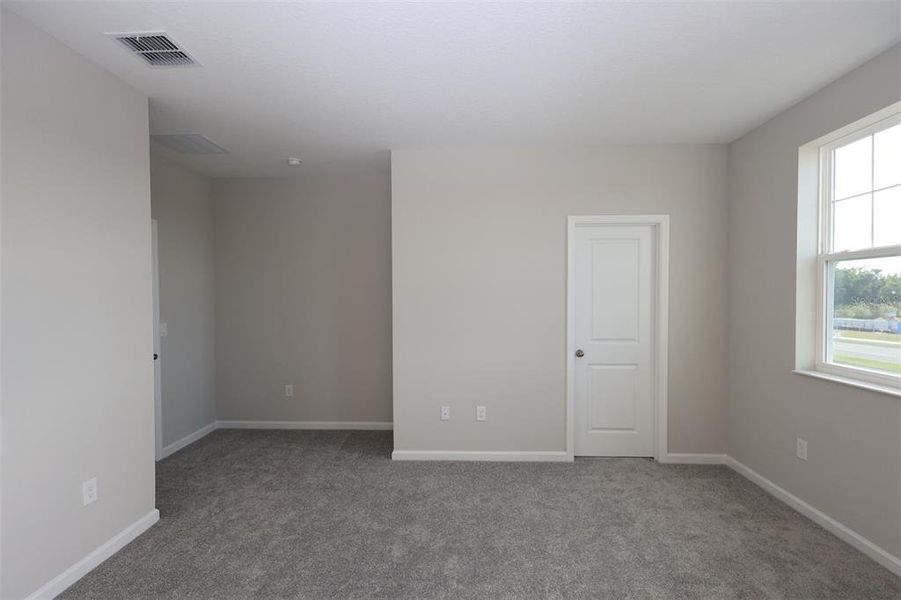 Spacious, unfurnished interior of a new home in Tribute at Ovation, Winter Garden (Image 43).