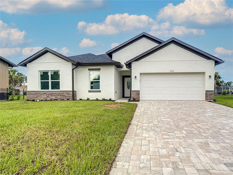Front exterior of a new home in , Port Charlotte, FL, highlighting curb appeal (Image 1). Front exterior of a new home in , Port Charlotte, FL, highlighting curb appeal (Image 1).
