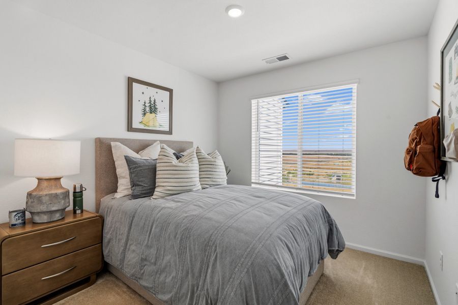 Representative furnished interior of a home built from the 2002 by Risewell Homes in Harvest Crossing, Aurora (Image 13).