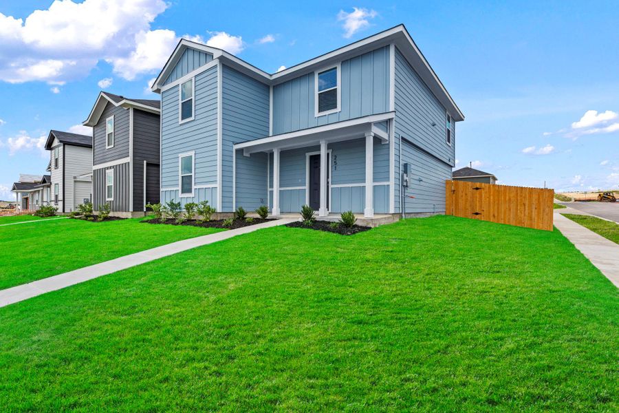 Exterior details and patio area of a home in Prairie Lakes, Buda (Image 3).