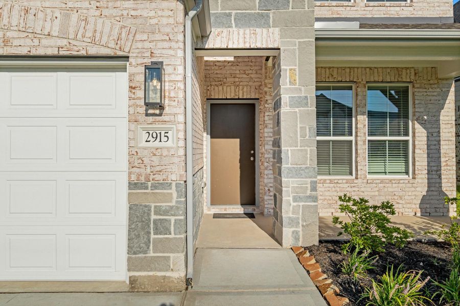 Front exterior of a new home in Morton Creek Ranch, Katy, TX, highlighting curb appeal (Image 16).