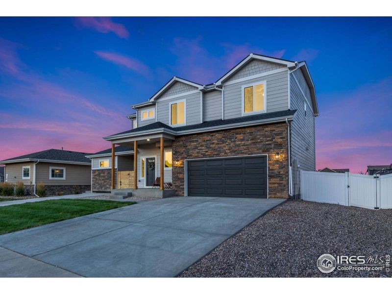 Front exterior of a new home in , Wellington, CO, highlighting curb appeal (Image 26).