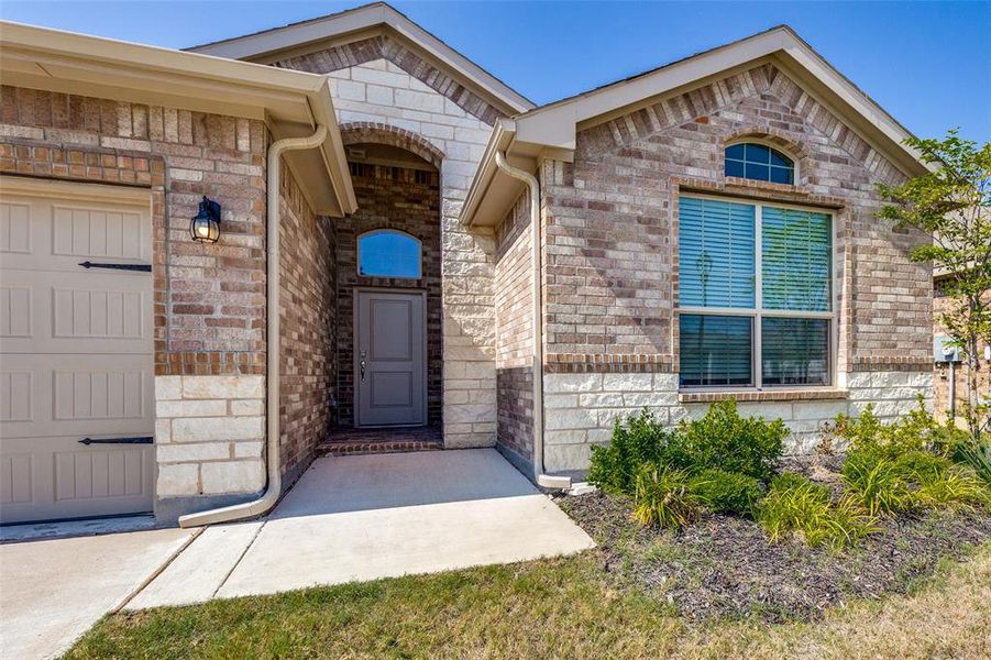 Front exterior of a new home in , Haslet, TX, highlighting curb appeal (Image 19). Front exterior of a new home in , Haslet, TX, highlighting curb appeal (Image 19).