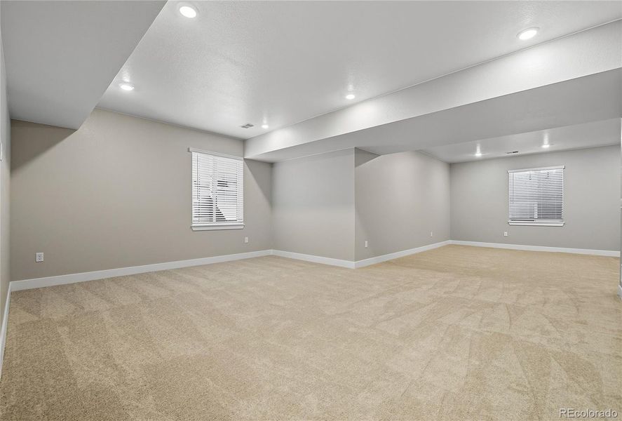 Additional Highlights Include: Finished full basement, bedroom and full bathroom at basement, modern fireplace and sliding glass door at gathering room, and standalone tub at primary bath.