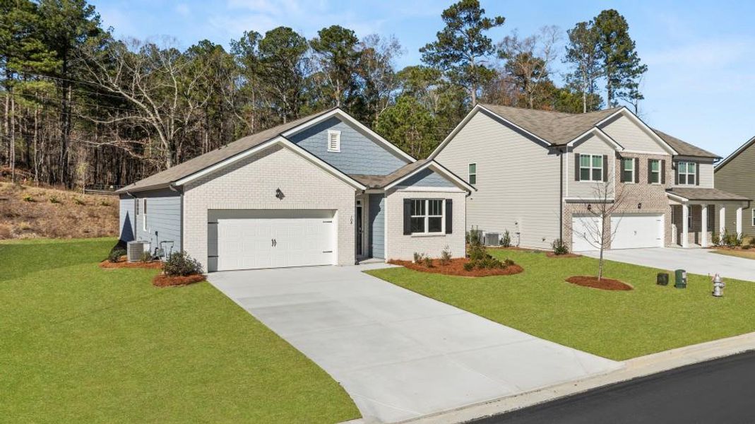 Front exterior of a new home in Northwoods at Mirror Lake, Villa Rica, GA, highlighting curb appeal (Image 2).