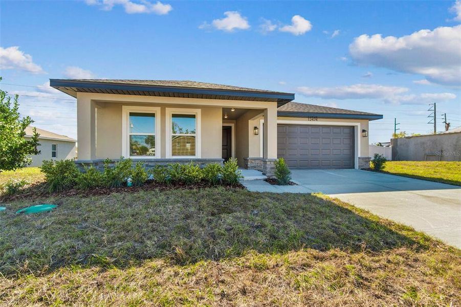 Front exterior of a new home in , Spring Hill, FL, highlighting curb appeal (Image 29).