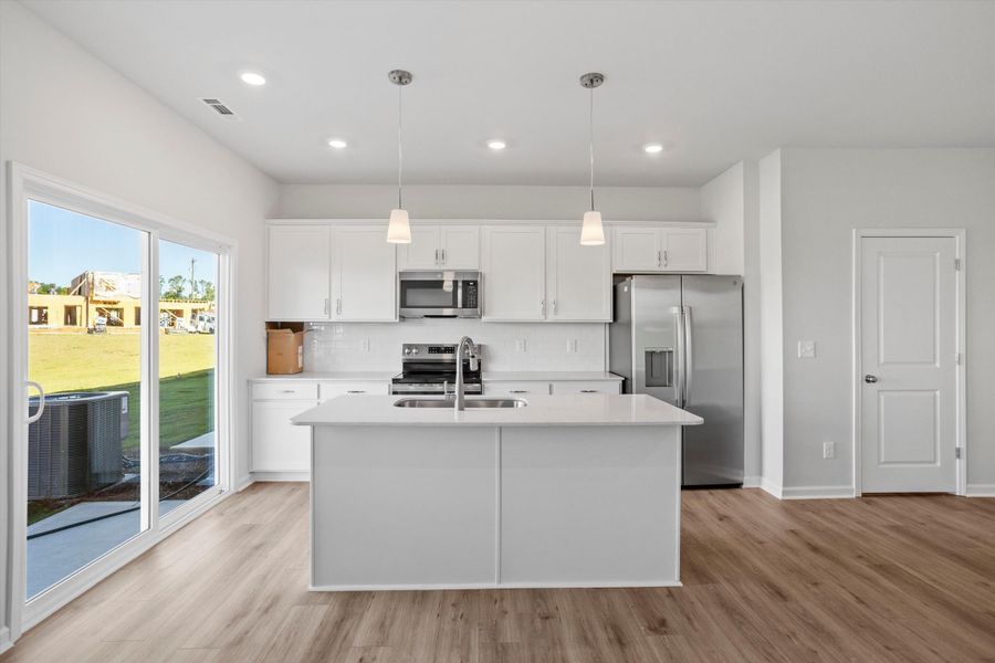 Furnished interior view inside a new home in West Main Townhomes, Sanford (Image 3).