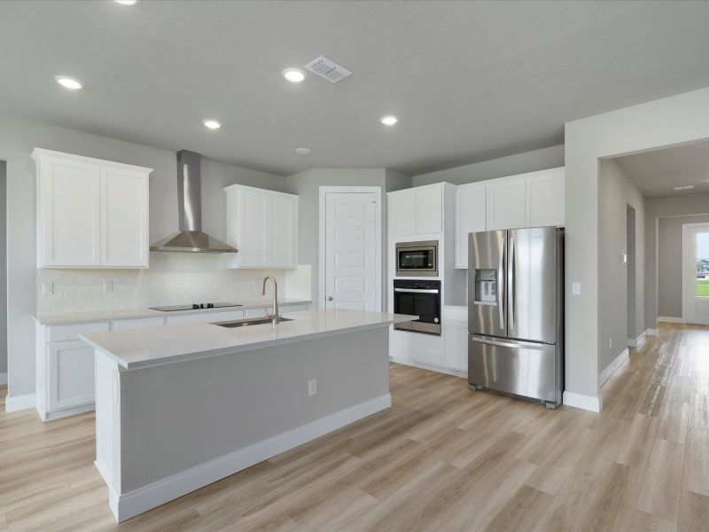 Kitchen in the Coral floorplan at 6295 NW Sweetwood Drive in Brystol at Wylder