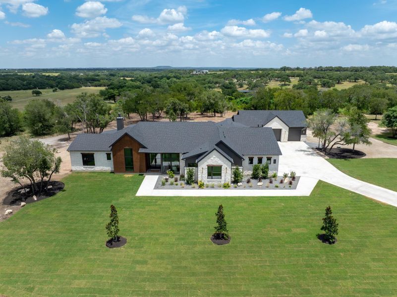 Front exterior of a new home in , Liberty Hill, TX, highlighting curb appeal (Image 25).