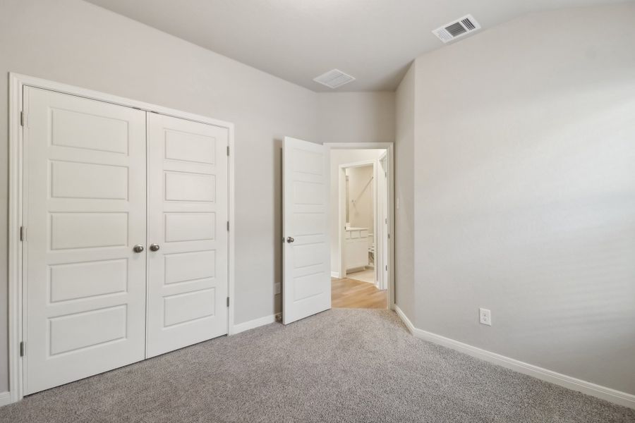 Guest bedroom in the Cascade floorplan at a Meritage Homes community.