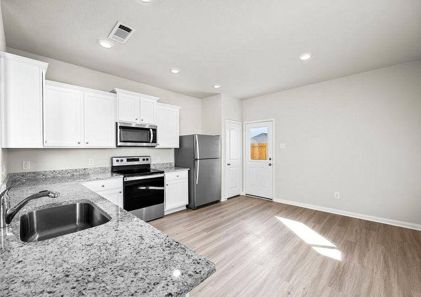 The kitchen comes with a full suite of energy-efficient appliances!