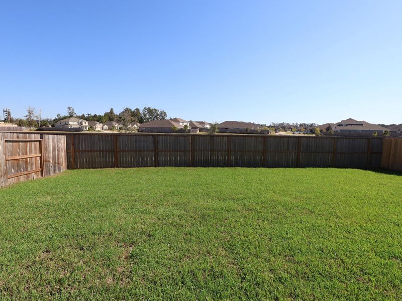 Exterior details and patio area of a home in Pinewood at Grand Texas, New Caney (Image 1).