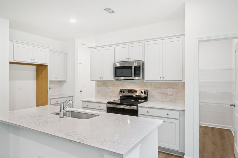 Representative furnished interior of a home built from the Brooke by Ashton Woods in Middleton Farms, Middlesex (Image 6).