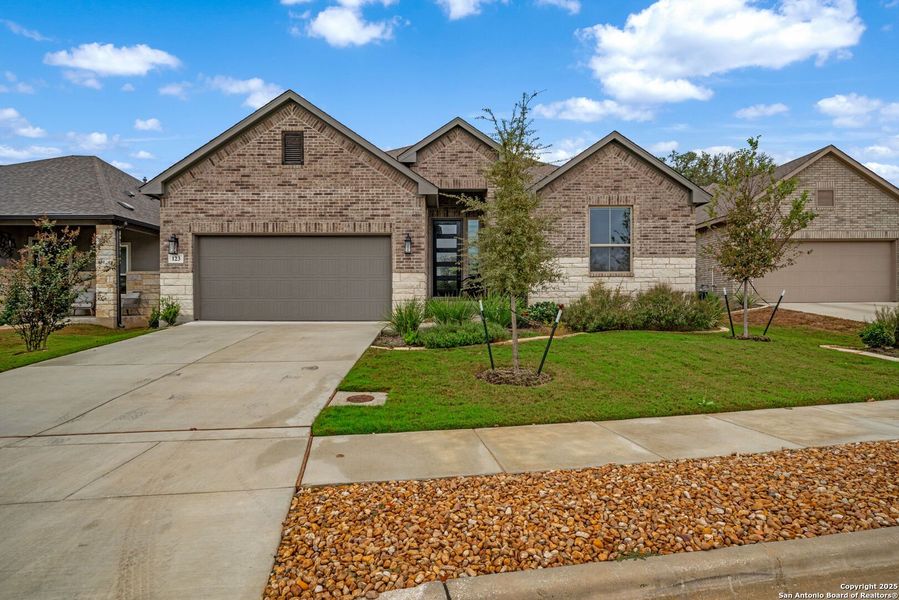 Front exterior of a new home in Cibolo Crossing, Universal City, TX, highlighting curb appeal (Image 25).