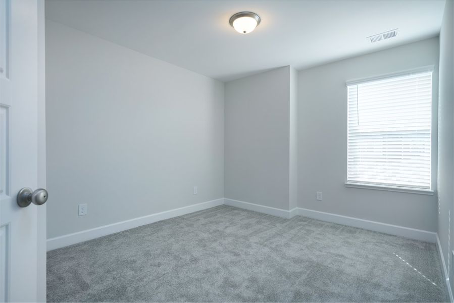 Representative unfurnished interior of a home built from the The Kennedy by Cothran Homes in Holly Ridge, Greenville (Image 36).