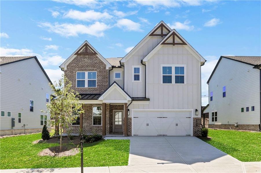 Front exterior of a new home in The Paddocks at Doc Hughes, Buford, GA, highlighting curb appeal (Image 2).