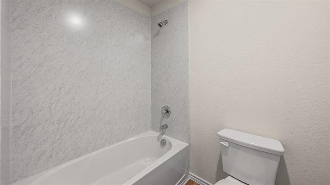 Full bath with toilet and  shower combination