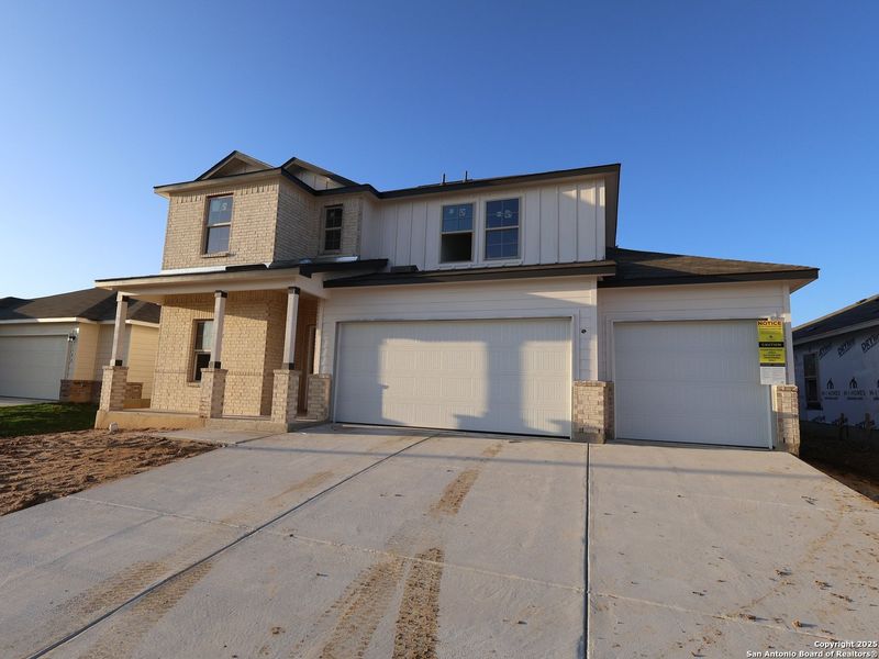 Front exterior of a new home in Greenspoint Heights, Seguin, TX, highlighting curb appeal (Image 1). Front exterior of a new home in Greenspoint Heights, Seguin, TX, highlighting curb appeal (Image 1).