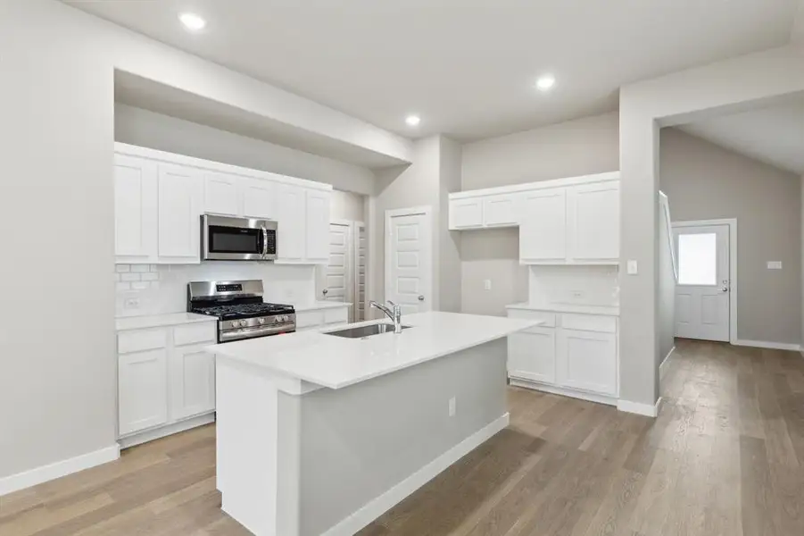 Kitchen in the Elm home plan by Trophy Signature Homes – REPRESENTATIVE PHOTO Kitchen in the Elm home plan by Trophy Signature Homes – REPRESENTATIVE PHOTO