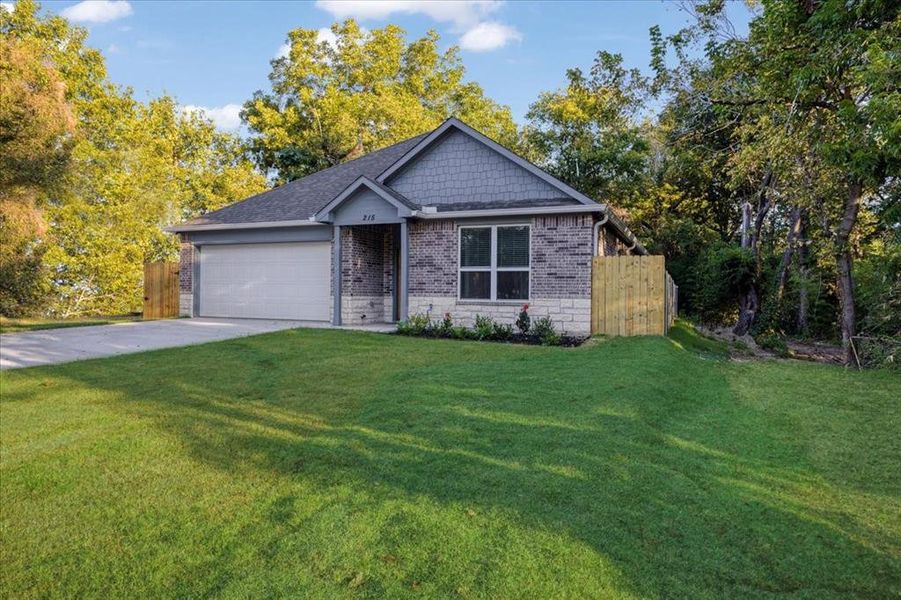 Front exterior of a new home in , Denison, TX, highlighting curb appeal (Image 1). Front exterior of a new home in , Denison, TX, highlighting curb appeal (Image 1).