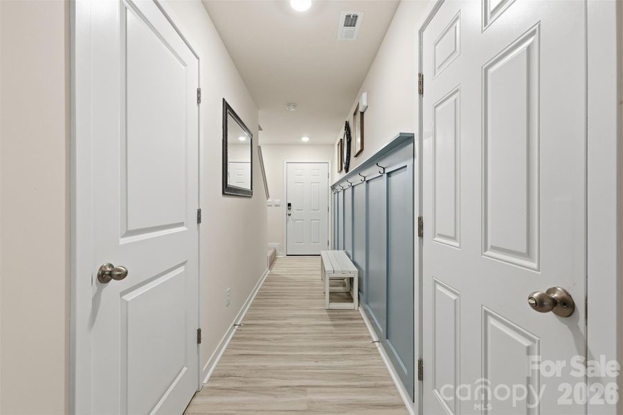 front entrance- board and baton trim detail power room, garage, stair access