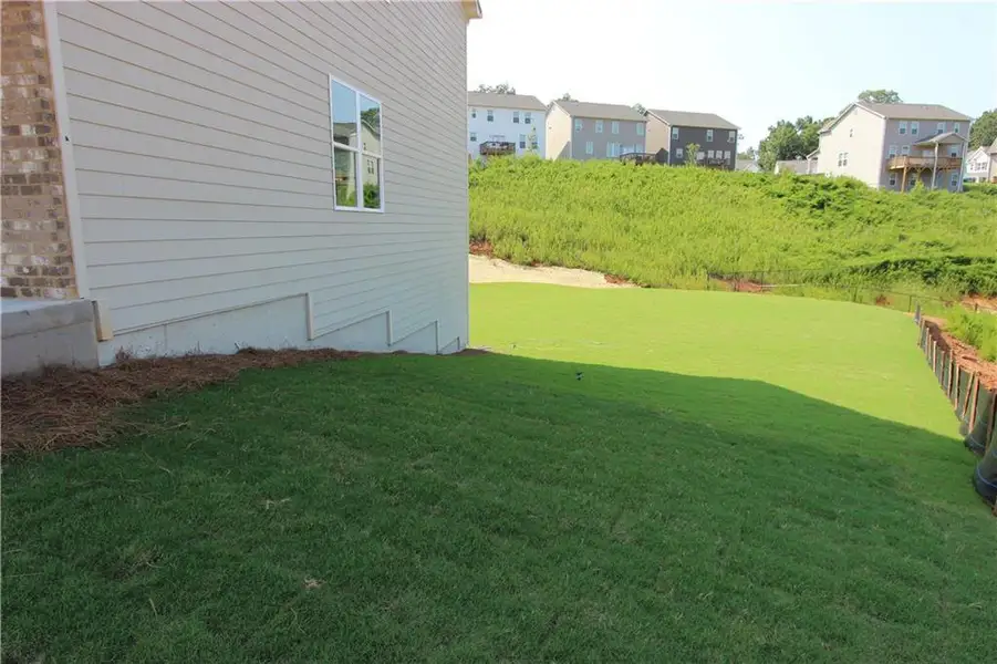 Exterior details and patio area of a home in Clark Farms, Flowery Branch (Image 13).
