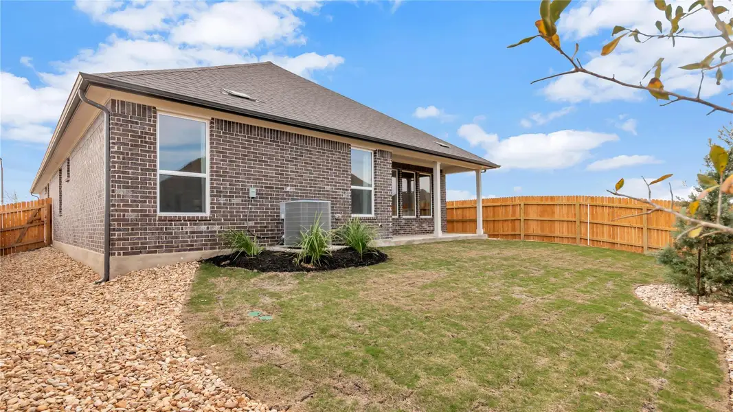 Front exterior of a new home in Rosenbusch Ranch, Leander, TX, highlighting curb appeal (Image 1). Front exterior of a new home in Rosenbusch Ranch, Leander, TX, highlighting curb appeal (Image 1).