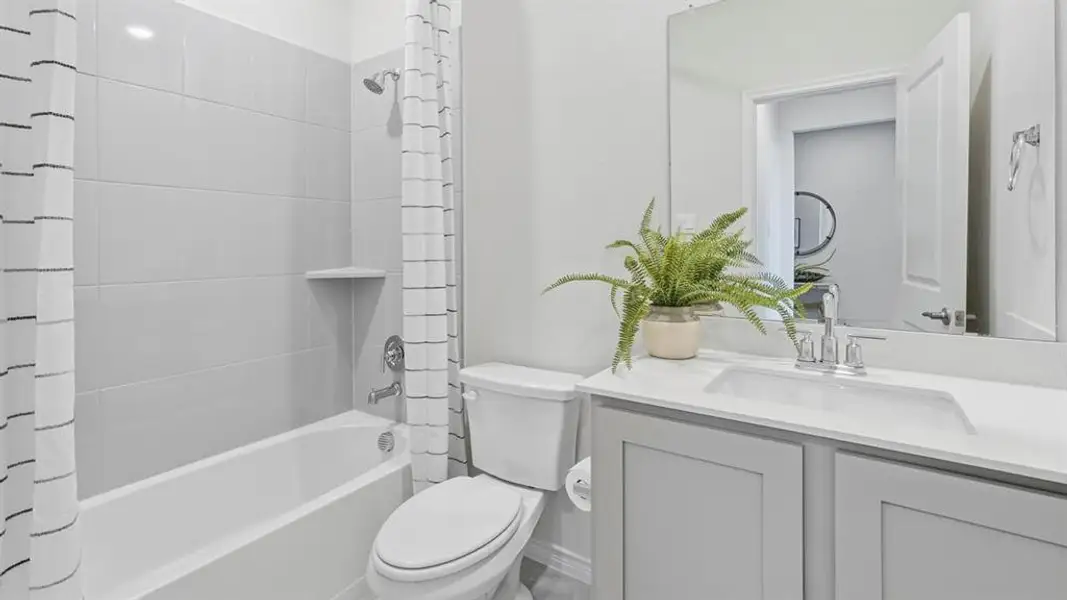 Full bath featuring vanity and shower / tub combo