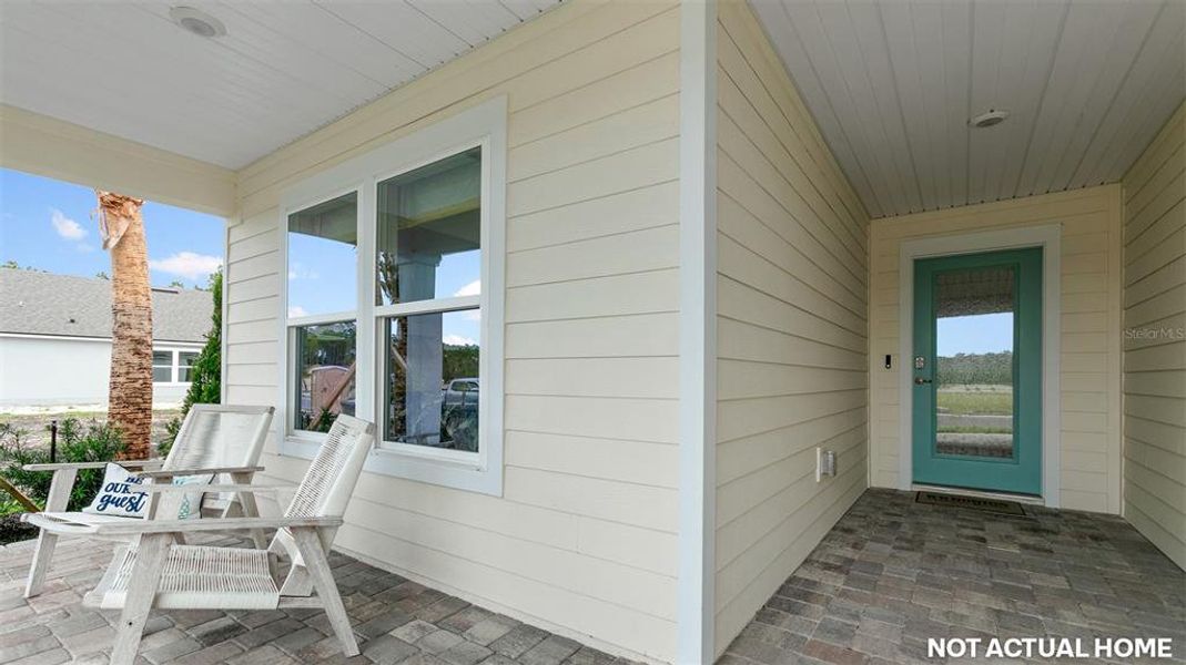 Exterior details and patio area of a home in Sawmill Branch, Palm Coast (Image 2).