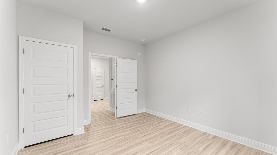 Representative unfurnished interior of a home built from the The Rhett by D.R. Horton in Pine Creek and Heron Walk, Port St. Joe (Image 28).
