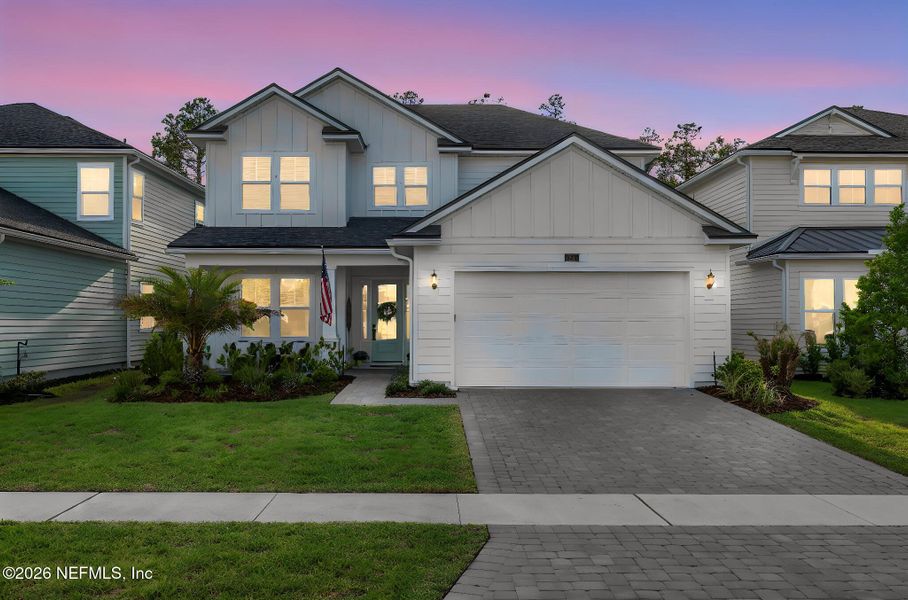 Front exterior of a new home in Settler's Landing at Nocatee, Ponte Vedra, FL, highlighting curb appeal (Image 31).