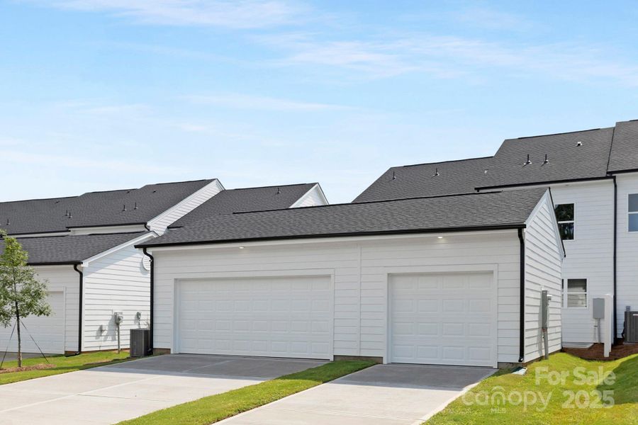 Front exterior of a new home in Edgewood Preserve, Huntersville, NC, highlighting curb appeal (Image 22). Front exterior of a new home in Edgewood Preserve, Huntersville, NC, highlighting curb appeal (Image 22).