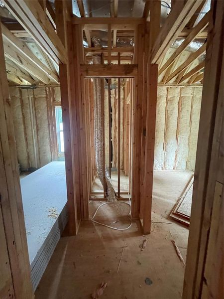 Hallway to the bedrooms with a Linen closet centered within