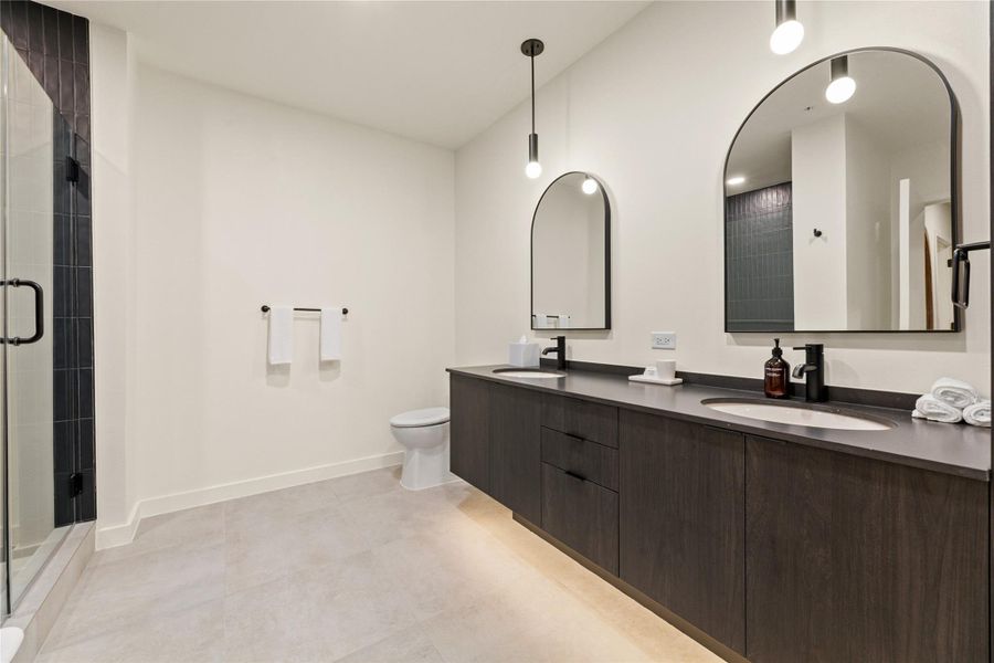 Clean lines and a spacious dual vanity define this modern bathroom with walk-in shower. Clean lines and a spacious dual vanity define this modern bathroom with walk-in shower.
