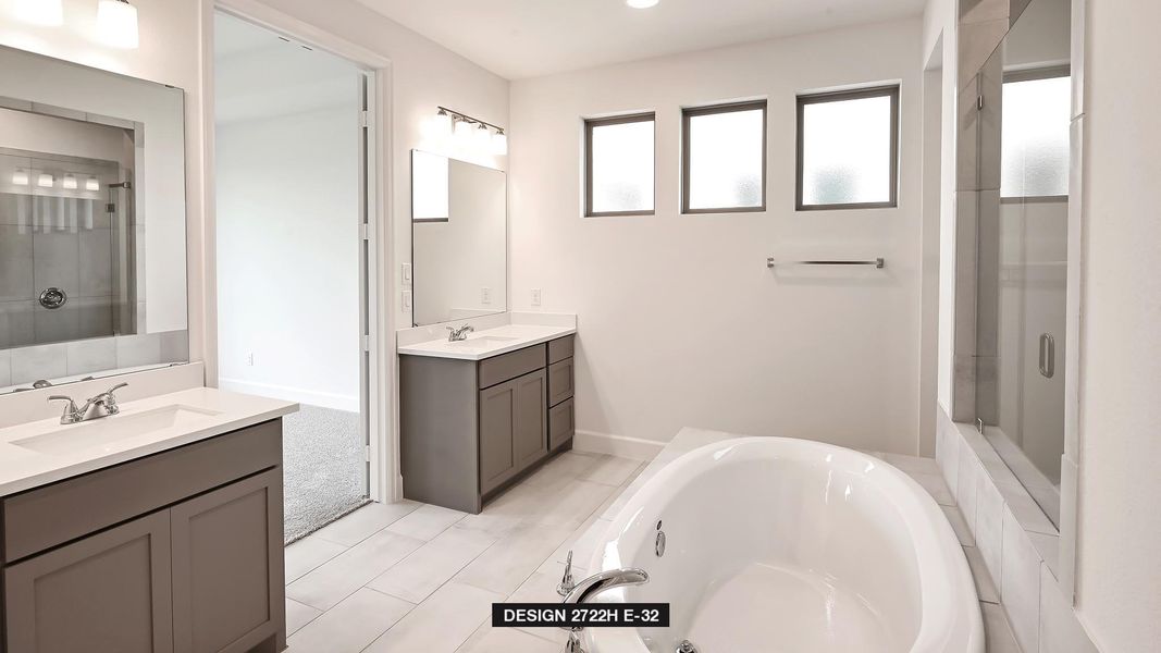 Full bath with two vanities, a tub with jets, and a stall shower