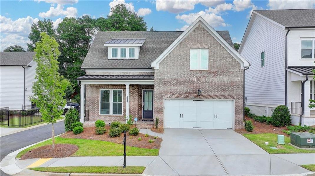 Front exterior of a new home in Ellington Townhomes, Suwanee, GA, highlighting curb appeal (Image 27).