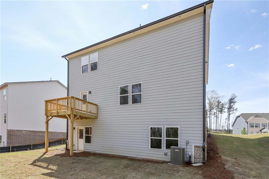 Exterior details and patio area of a home in The Pointe at Heron Bay, Locust Grove (Image 4).
