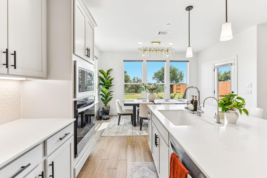 A well-appointed kitchen island with integrated sink and modern fixtures, perfect for daily use.