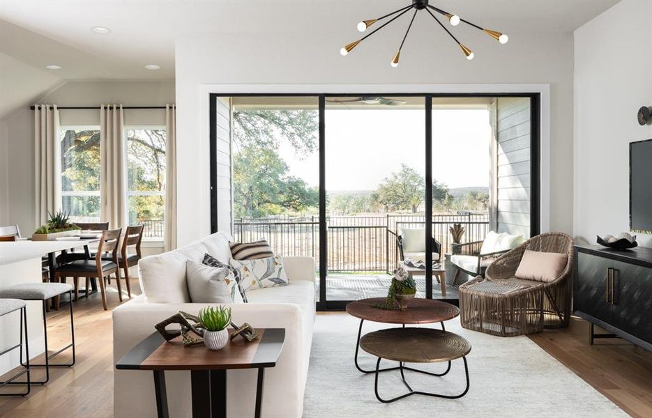 The custom light fixture and upgraded carpet accentuates the space.