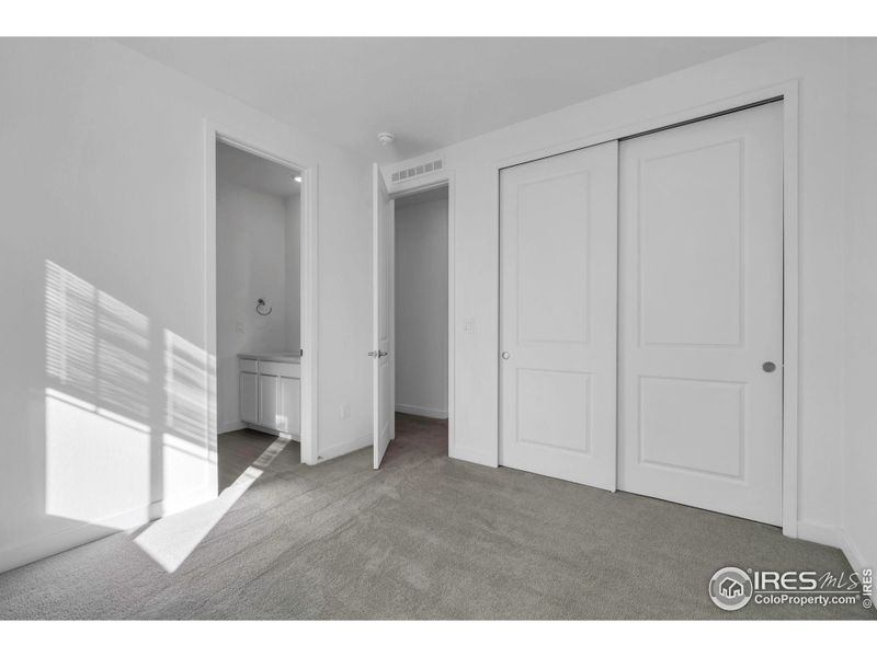 Bedroom 2 with Jack-n-Jill bathroom, leading to bedroom 3 Bedroom 2 with Jack-n-Jill bathroom, leading to bedroom 3