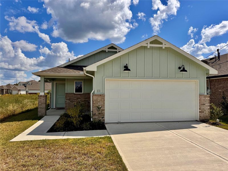 Front exterior of a new home in Santa Fe, Cleveland, TX, highlighting curb appeal (Image 16). Front exterior of a new home in Santa Fe, Cleveland, TX, highlighting curb appeal (Image 16).