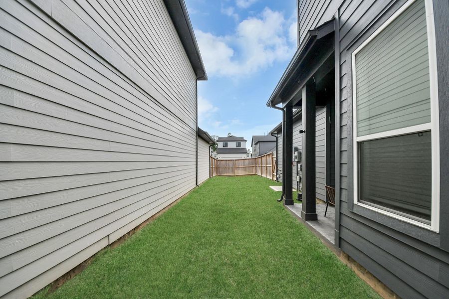 Exterior details and patio area of a home in The Groves 35', Humble (Image 34). Exterior details and patio area of a home in The Groves 35', Humble (Image 34).