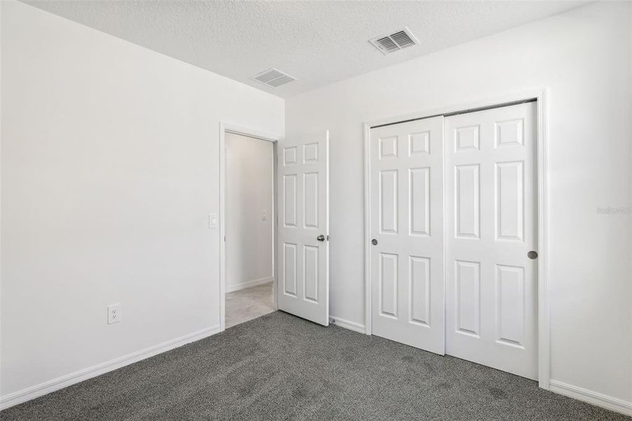 Spacious, unfurnished interior of a new home in Lake Deer Estates - Classic Series, Poinciana (Image 24).