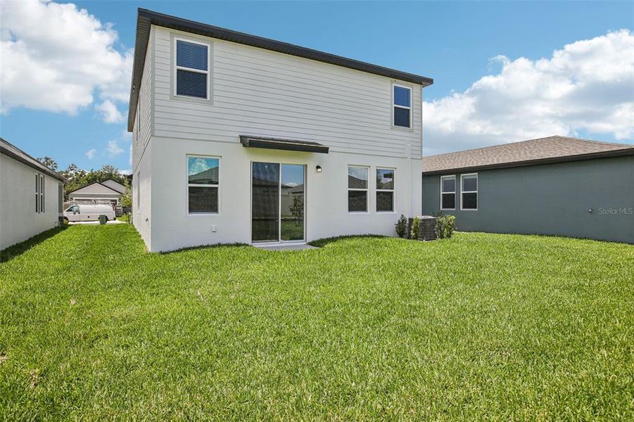 Exterior details and patio area of a home in Two Rivers - Premier Series, Zephyrhills (Image 3).