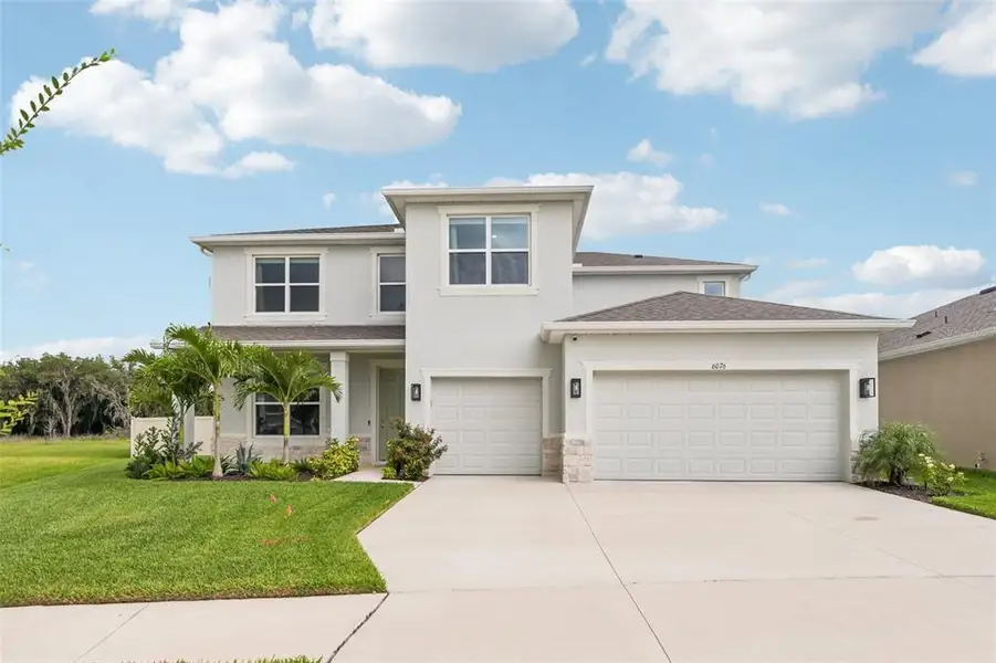 Front exterior of a new home in , Wesley Chapel, FL, highlighting curb appeal (Image 1). Front exterior of a new home in , Wesley Chapel, FL, highlighting curb appeal (Image 1).