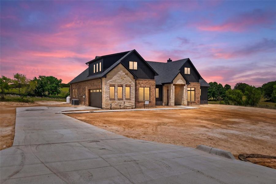 Front exterior of a new home in , Poolville, TX, highlighting curb appeal (Image 2). Front exterior of a new home in , Poolville, TX, highlighting curb appeal (Image 2).