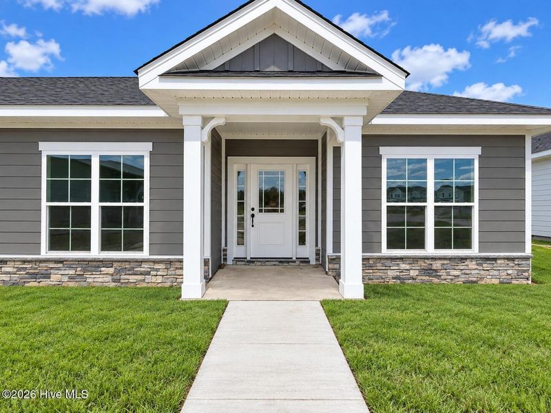 Exterior details and patio area of a home in East Lake, Leland (Image 3).