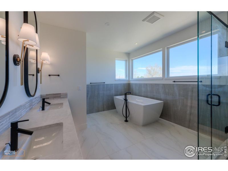 Primary Bath Has Large Windows With Mountain Views