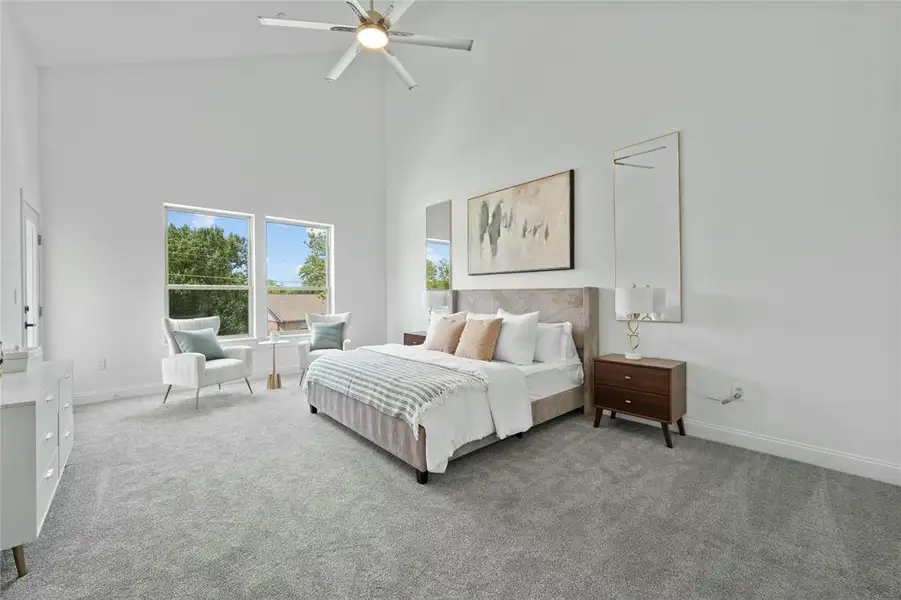 Bedroom featuring high vaulted ceiling, carpet flooring, baseboards, and a ceiling fan